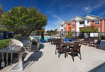 Poolside dining area with gas grills